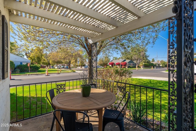 balcony featuring a pergola