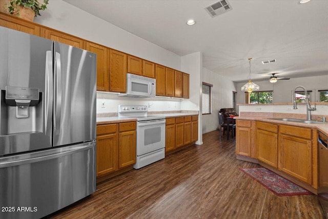 8237 W Alex Ave, Peoria, AZ 85382 - kitchen with a sink, dark wood-type flooring, white appliances, and visible vents