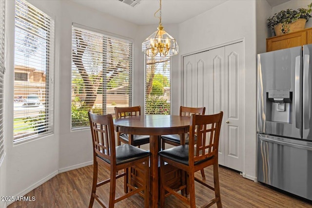 8237 W Alex Ave, Peoria, AZ 85382 - dining room featuring baseboards, dark wood finished floors, and a notable chandelier
