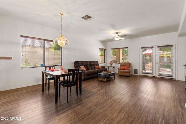 8237 W Alex Ave, Peoria, AZ 85382 - dining area with visible vents, baseboards, dark wood-type flooring, and ceiling fan with notable chandelier
