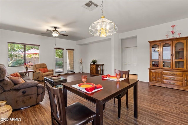 8237 W Alex Ave, Peoria, AZ 85382 - dining area with ceiling fan with notable chandelier, dark wood-style flooring, and visible vents