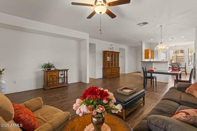 8237 W Alex Ave, Peoria, AZ 85382 - living room featuring ceiling fan with notable chandelier, recessed lighting, baseboards, wood finished floors, and visible vents