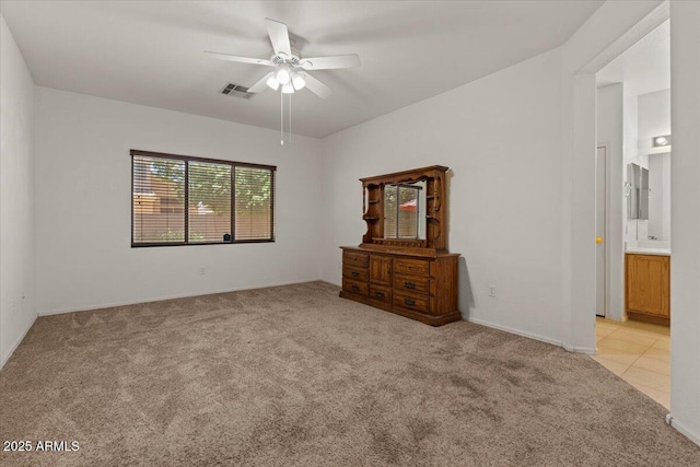 8237 W Alex Ave, Peoria, AZ 85382 - unfurnished bedroom with light colored carpet, ensuite bath, a ceiling fan, baseboards, and visible vents