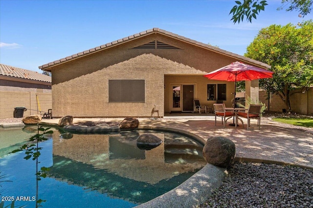 8237 W Alex Ave, Peoria, AZ 85382 - back of property featuring a fenced backyard, a patio area, and stucco siding