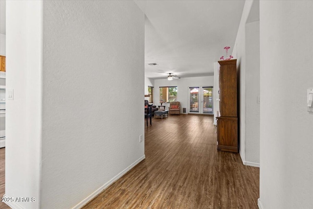 8237 W Alex Ave, Peoria, AZ 85382 - hallway featuring baseboards, a textured wall, and wood finished floors