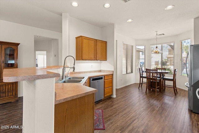 8237 W Alex Ave, Peoria, AZ 85382 - kitchen with dark wood-style flooring, appliances with stainless steel finishes, a sink, light countertops, and a peninsula