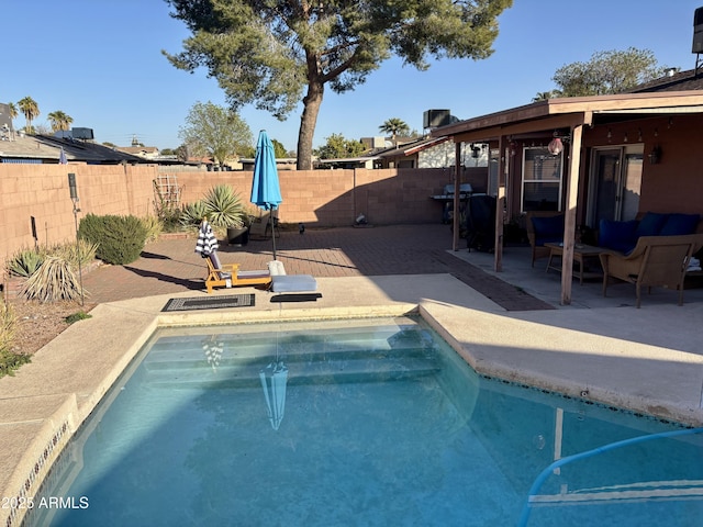 view of pool featuring a patio