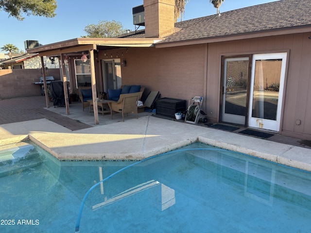 view of swimming pool with a patio area