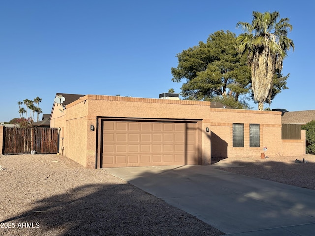 ranch-style home featuring a garage