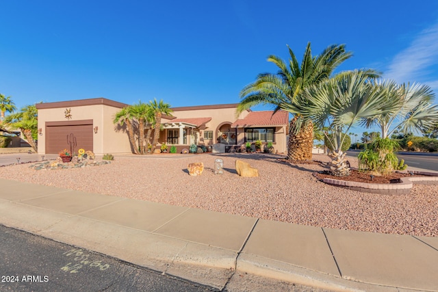 view of front of property with a garage