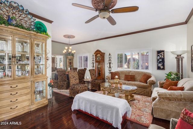 living room featuring dark wood-type flooring, crown molding, and ceiling fan with notable chandelier