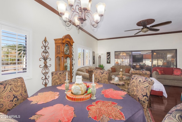 dining area with crown molding, plenty of natural light, wood-type flooring, and ceiling fan with notable chandelier