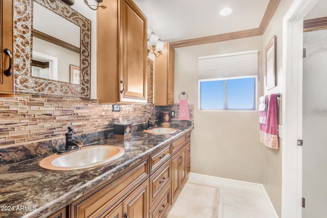 bathroom with crown molding, vanity, tile patterned flooring, and decorative backsplash