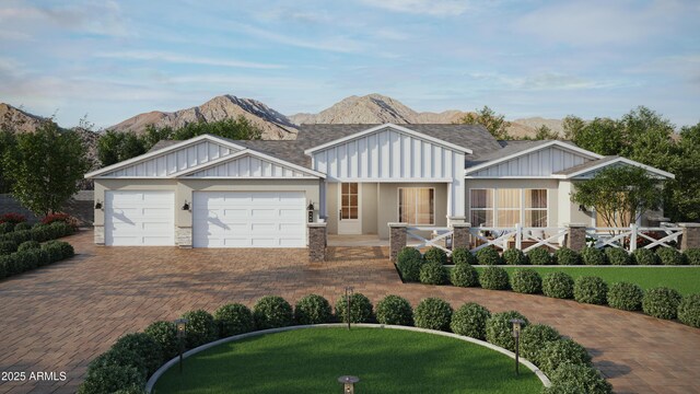 26560 S 188th Pl, Queen Creek, AZ 85142 - view of front of house featuring stone siding, an attached garage, board and batten siding, decorative driveway, and a mountain view