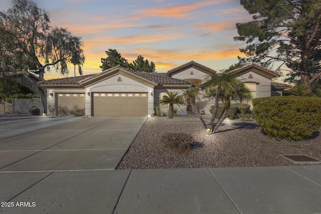 mediterranean / spanish-style home featuring a garage