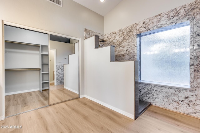 bathroom featuring plenty of natural light and wood-type flooring