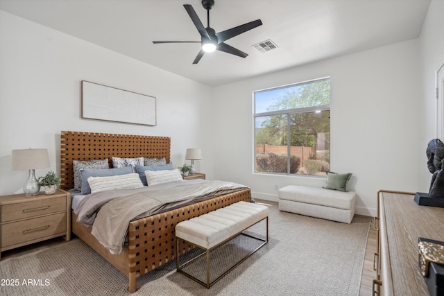 1029 E Ian Dr, Phoenix, AZ 85042 - bedroom featuring wood finished floors, baseboards, and a ceiling fan