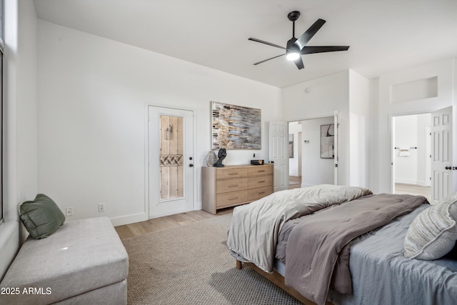 1029 E Ian Dr, Phoenix, AZ 85042 - bedroom with light wood finished floors, ensuite bath, baseboards, and a ceiling fan