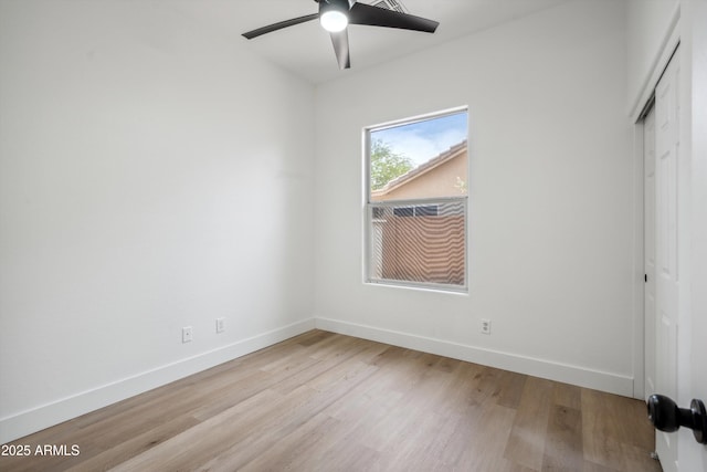 1029 E Ian Dr, Phoenix, AZ 85042 - unfurnished bedroom with a closet, light wood-type flooring, baseboards, and ceiling fan