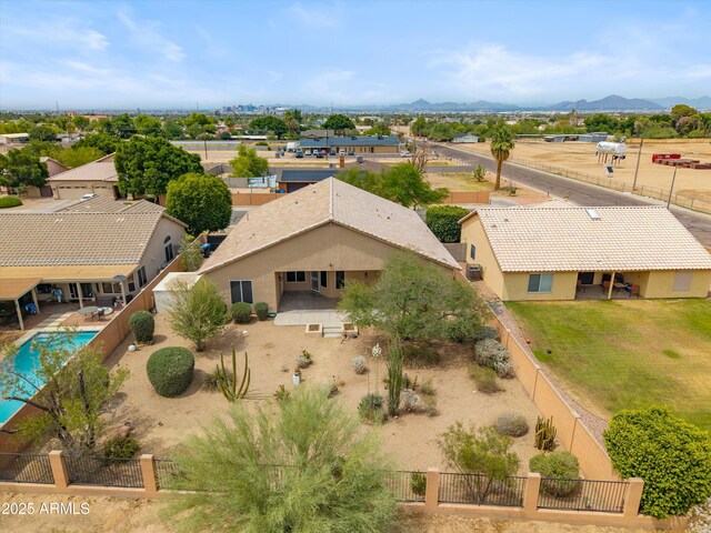 1029 E Ian Dr, Phoenix, AZ 85042 - aerial view of property and surrounding area featuring a pool area and a mountainous background
