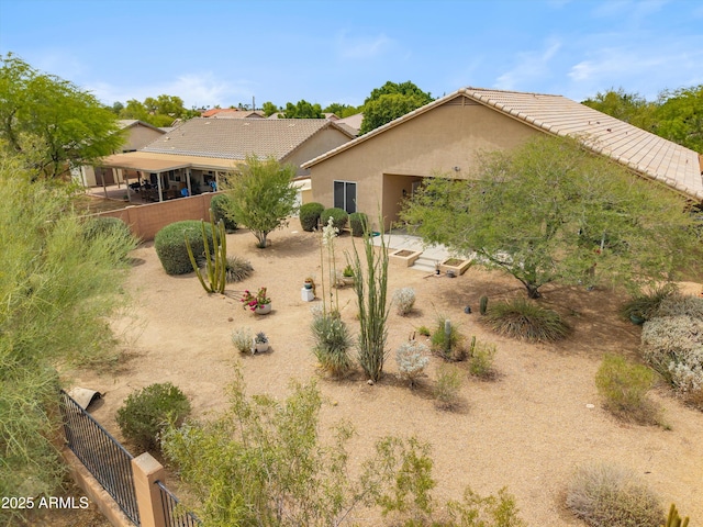 1029 E Ian Dr, Phoenix, AZ 85042 - rear view of property featuring stucco siding and a tiled roof