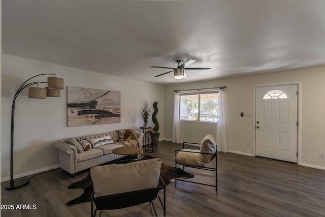 living room with ceiling fan and dark hardwood / wood-style floors