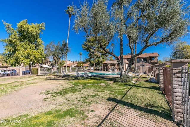 view of yard featuring a community pool