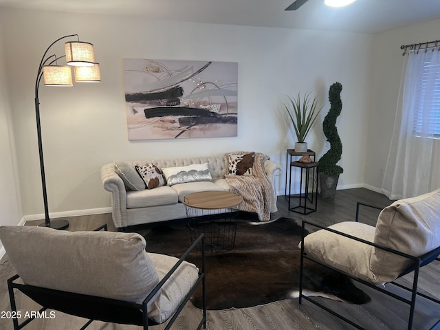 living room featuring hardwood / wood-style flooring and ceiling fan