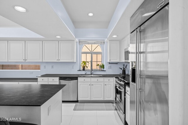 kitchen with white cabinets, sink, and stainless steel appliances