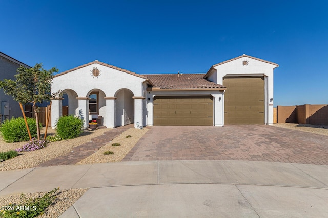 mediterranean / spanish-style house featuring a garage