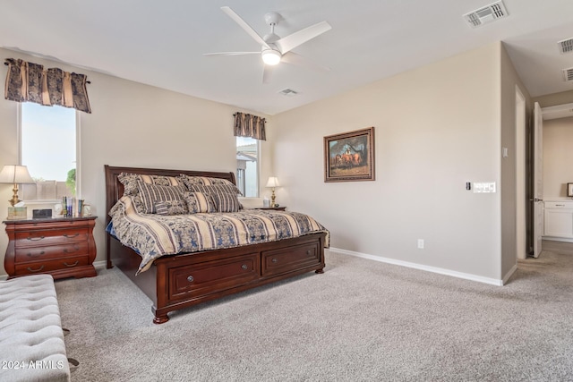 bedroom with light colored carpet and ceiling fan