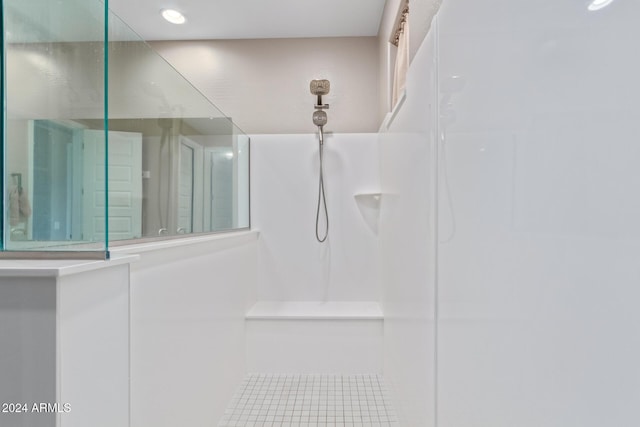 bathroom featuring tile patterned flooring and walk in shower