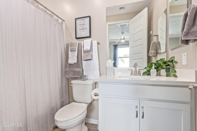 bathroom with tile patterned floors, ceiling fan, vanity, and toilet