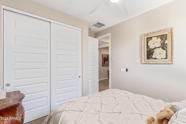 bedroom featuring ceiling fan and a closet