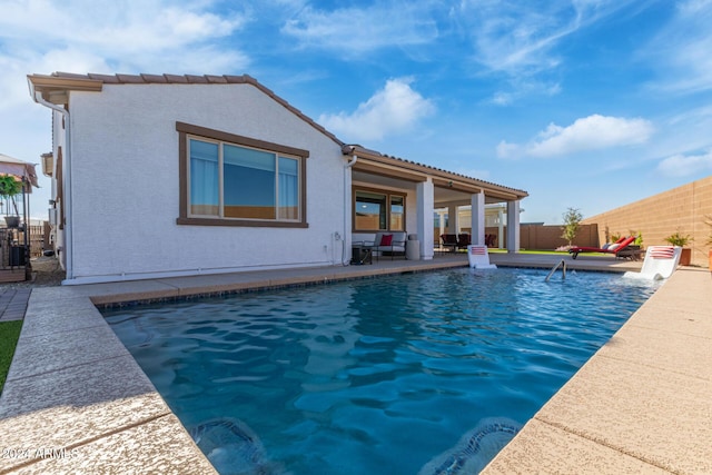 view of pool featuring a patio area