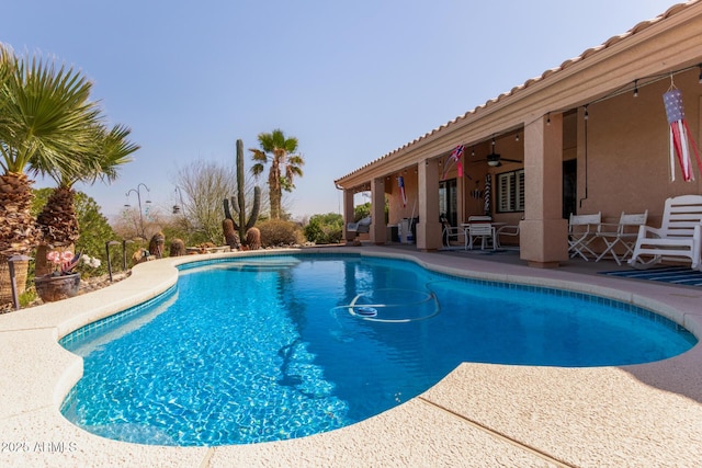 pool featuring a patio area and a ceiling fan