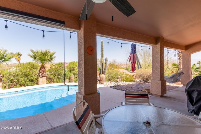 pool featuring a patio area and outdoor dining space