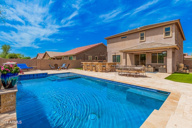 view of swimming pool with a patio area