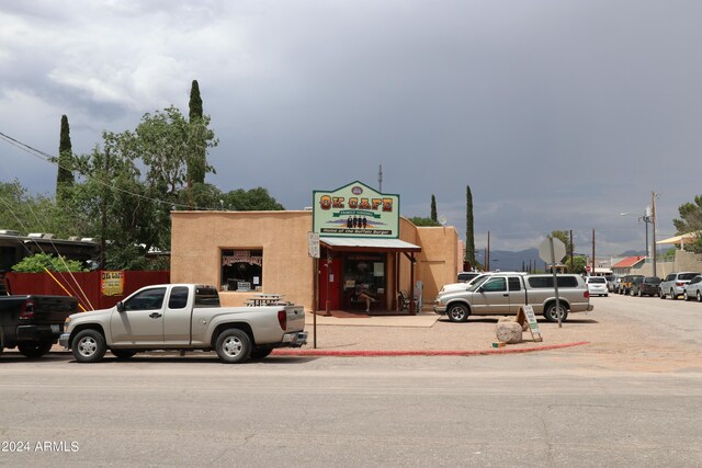 view of building exterior featuring uncovered parking