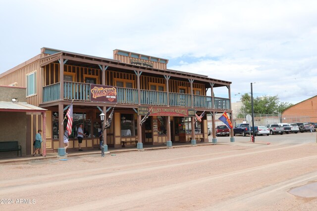 view of property featuring uncovered parking