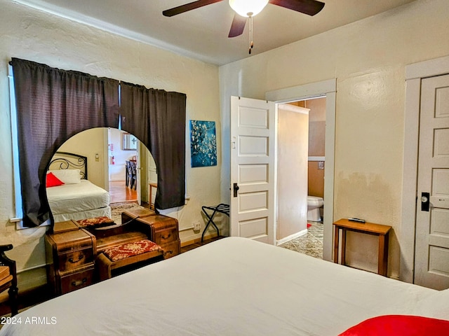 bedroom featuring ensuite bathroom and ceiling fan