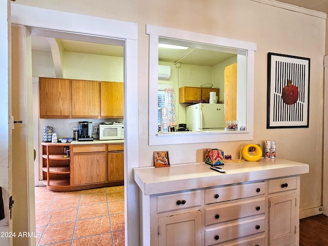 kitchen featuring white appliances and crown molding