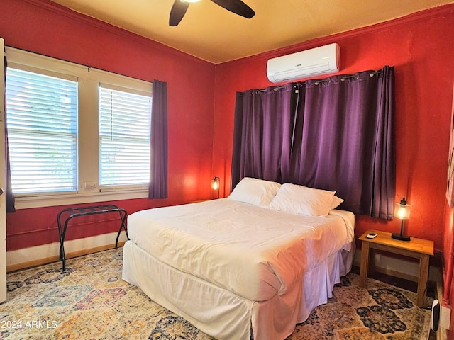 bedroom featuring ceiling fan and a wall mounted air conditioner