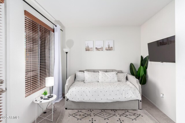 bedroom with light colored carpet