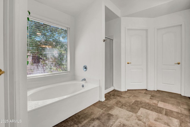 1831 W Armstrong Way, Chandler, AZ 85286 - bathroom featuring a bath, a stall shower, and stone finish floors