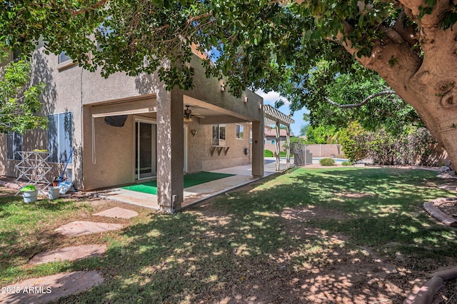 1831 W Armstrong Way, Chandler, AZ 85286 - rear view of property featuring stucco siding, a ceiling fan, and a patio area