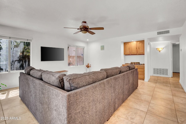 1831 W Armstrong Way, Chandler, AZ 85286 - living room with light tile patterned floors and a ceiling fan
