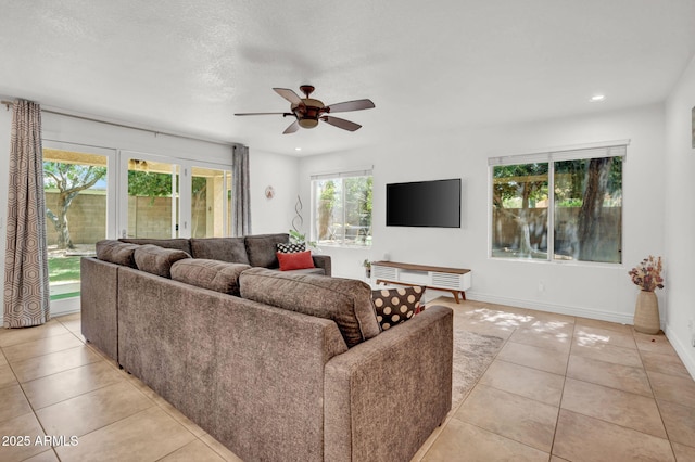 1831 W Armstrong Way, Chandler, AZ 85286 - living area with ceiling fan, light tile patterned floors, and recessed lighting
