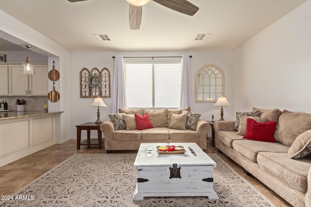 living area with a ceiling fan