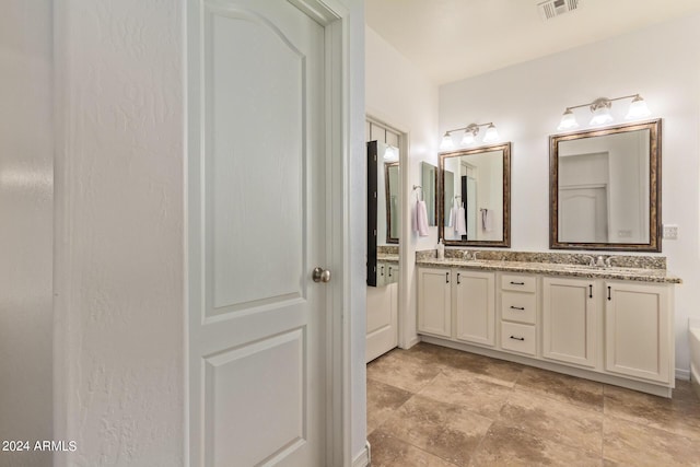 full bathroom with double vanity